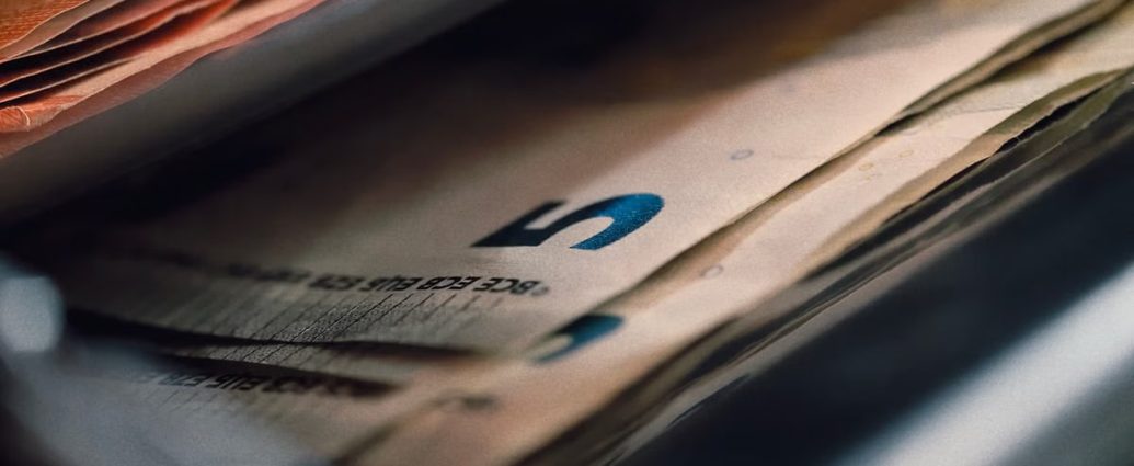 Detailed view of Euro banknotes inside a wallet, emphasizing currency and finance.